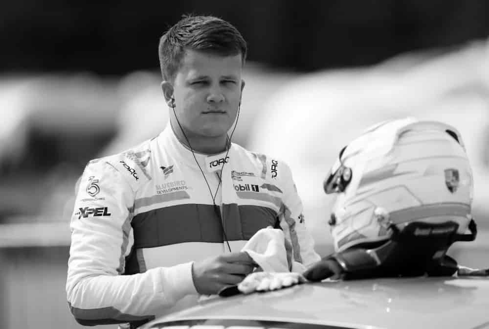 A picture displaying a semi-proffesional racer and and a racing coach Max Bird